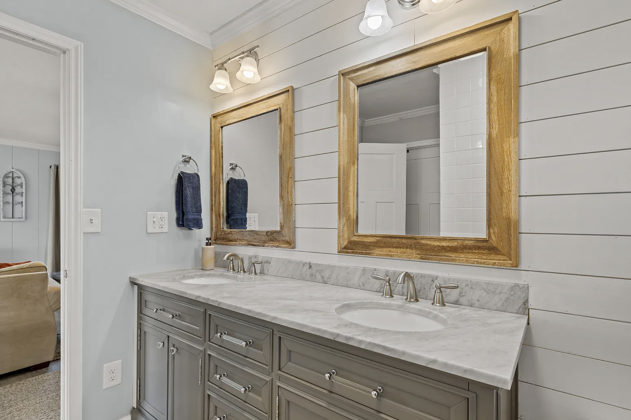 Second bathroom double vanity with wood-framed mirrors, attached to the Second King Bedroom